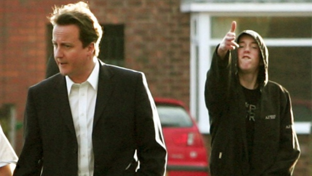 David Cameron and a young man in a hoodie